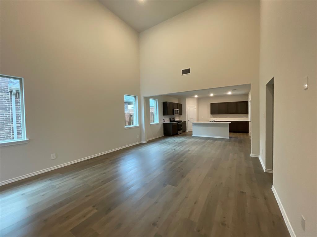 657 Chipper Trail Lavon, TX 75166 - Photo 7 of 24 a view of kitchen with furniture and wooden floor