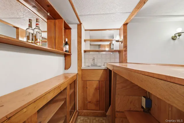 a view of a large kitchen with furniture and a window