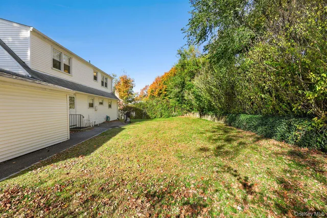 a view of a yard with potted plants