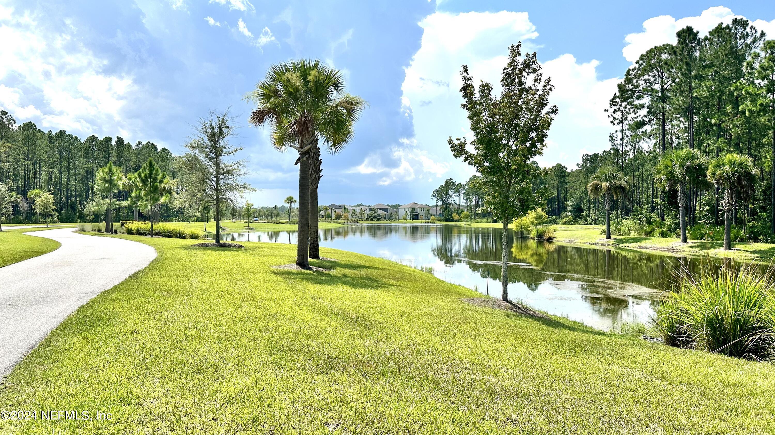 348 Ladyslipper Drive St. Johns, FL 32259 - Photo 52 of 54 a view of a lake with houses