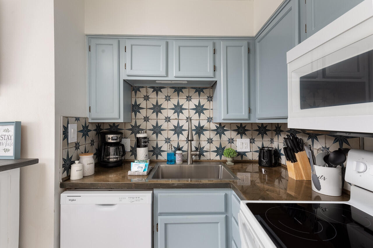 200 Sandestin Lane, Unit 616 Miramar Beach, FL 32550 - Photo 11 of 30 a kitchen with a sink and cabinets