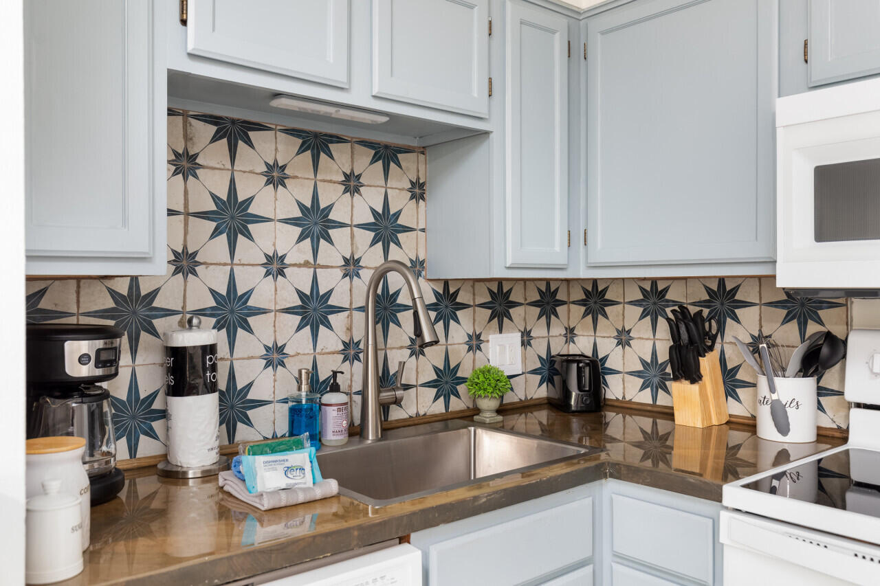 200 Sandestin Lane, Unit 616 Miramar Beach, FL 32550 - Photo 12 of 30 a kitchen with a sink and cabinets