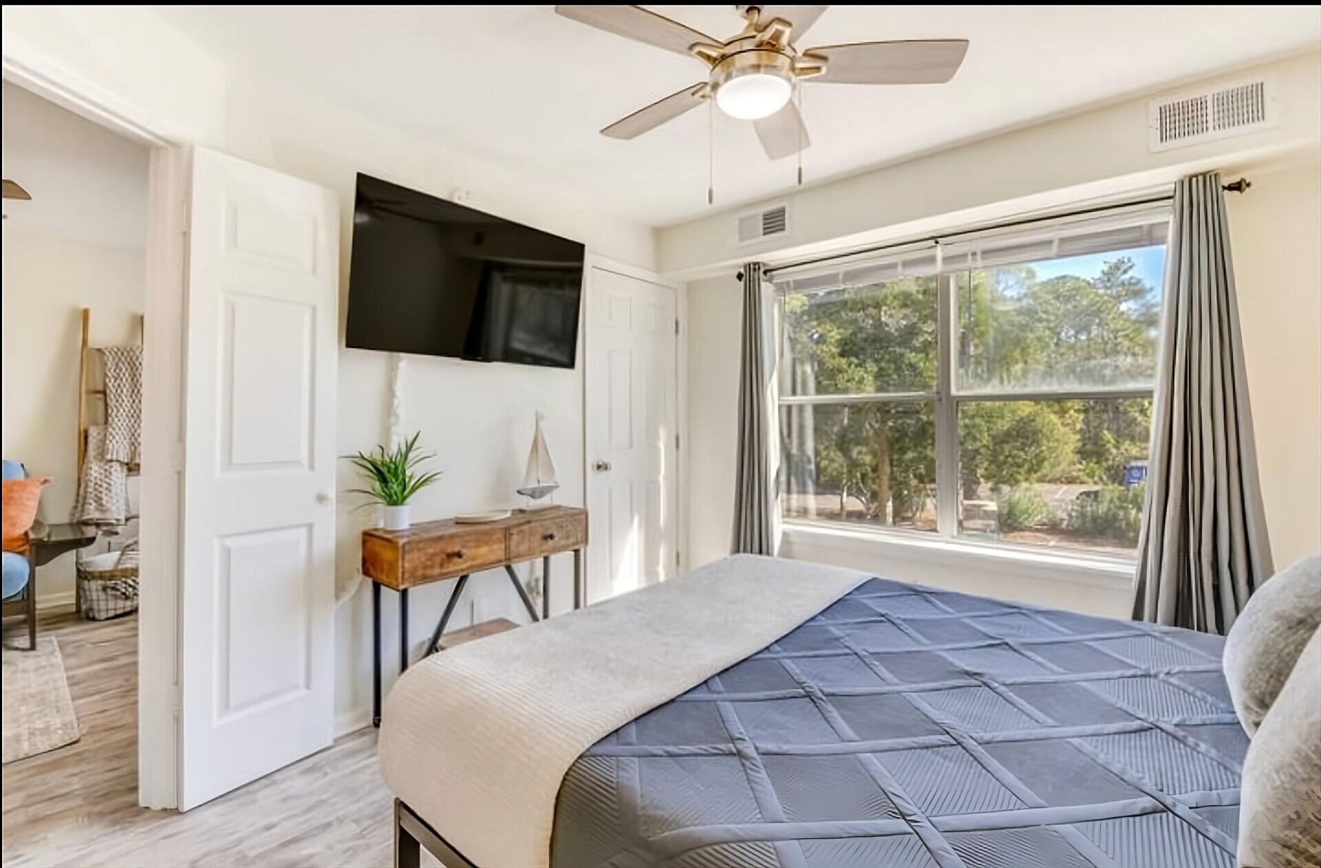 200 Sandestin Lane, Unit 616 Miramar Beach, FL 32550 - Photo 18 of 30 a bedroom with a bed and a flat screen tv