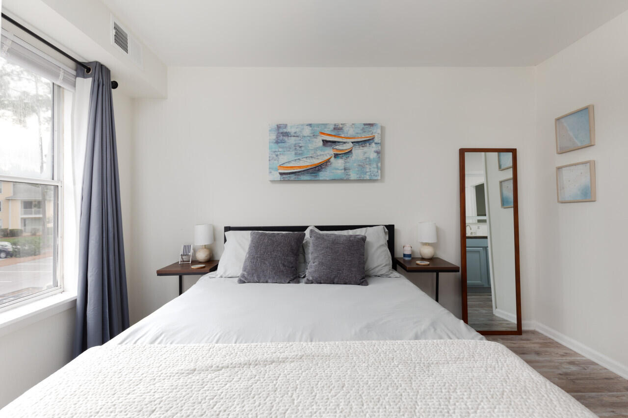 200 Sandestin Lane, Unit 616 Miramar Beach, FL 32550 - Photo 19 of 30 a bedroom with a large bed and a window