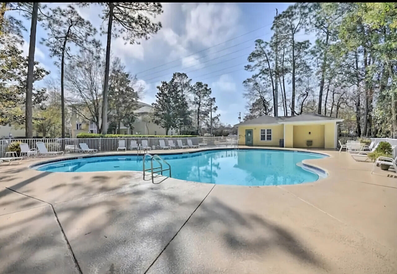 200 Sandestin Lane, Unit 616 Miramar Beach, FL 32550 - Photo 23 of 30 a view of a swimming pool with a yard
