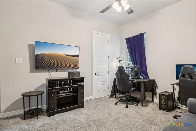 a room with furniture and gym equipment