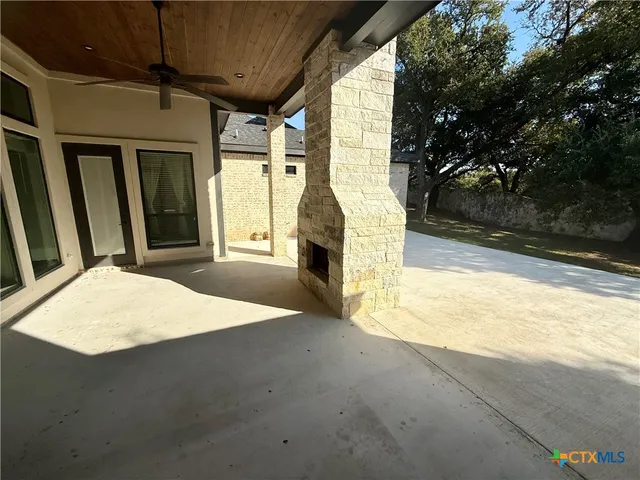 a view of a yard with a tree