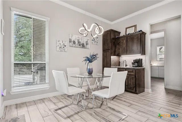 a dining room with furniture and window