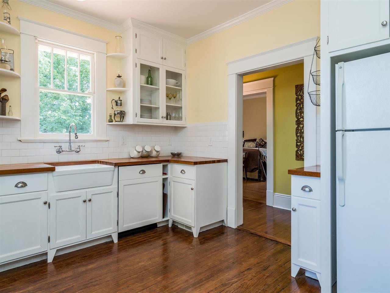 1806 Wills Avenue Raleigh, NC 27608 - Photo 14 of 28 The dishwasher is new and has a custom cabinet front and the glass front cabinets are a great addition. Kitchen