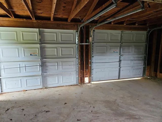 a view of an empty room with a wooden door