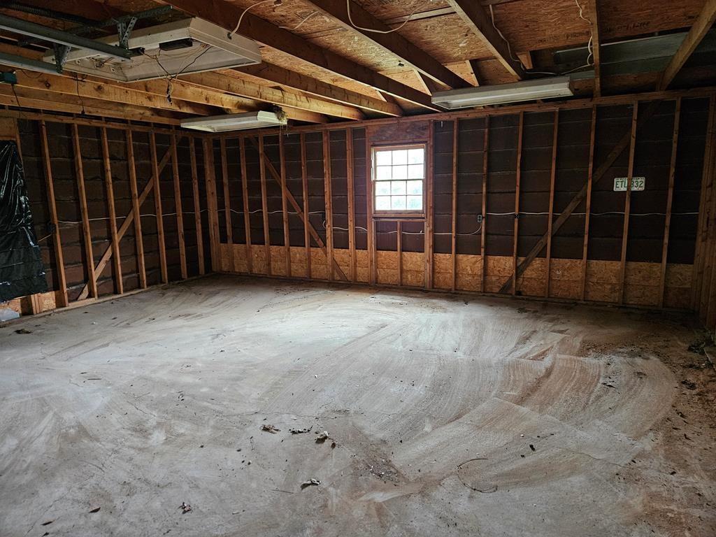 306 Grady Whitton Road Bremen, GA 30110 - Photo 19 of 48 a view of an empty room with a wooden door