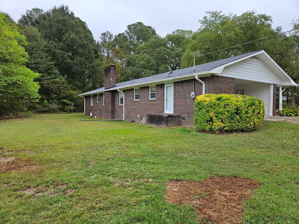 306 Grady Whitton Road Bremen, GA 30110 - Photo 22 of 48 a front view of a house with garden