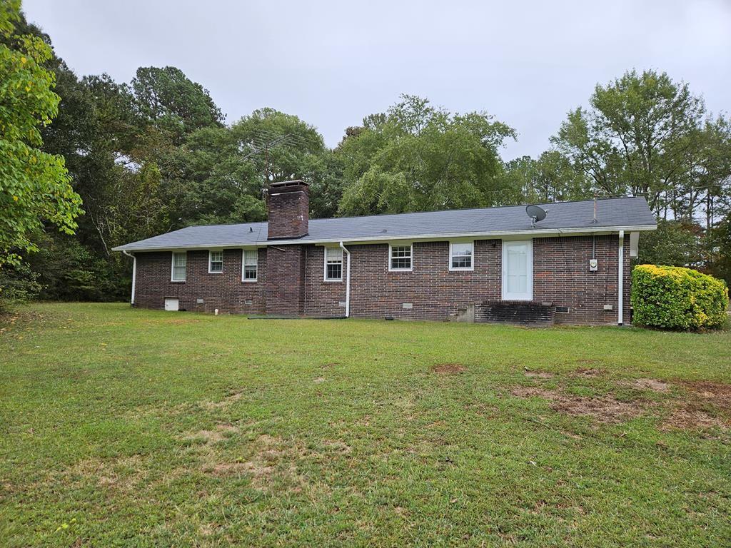 306 Grady Whitton Road Bremen, GA 30110 - Photo 23 of 48 a backyard of a house with lots of green space