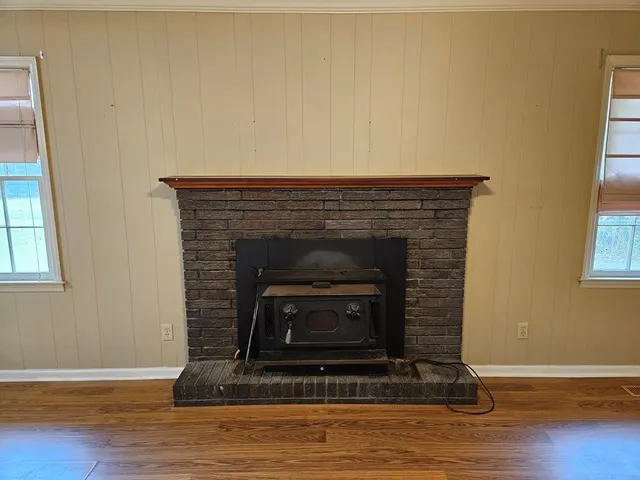 a dining room with furniture and wooden floor