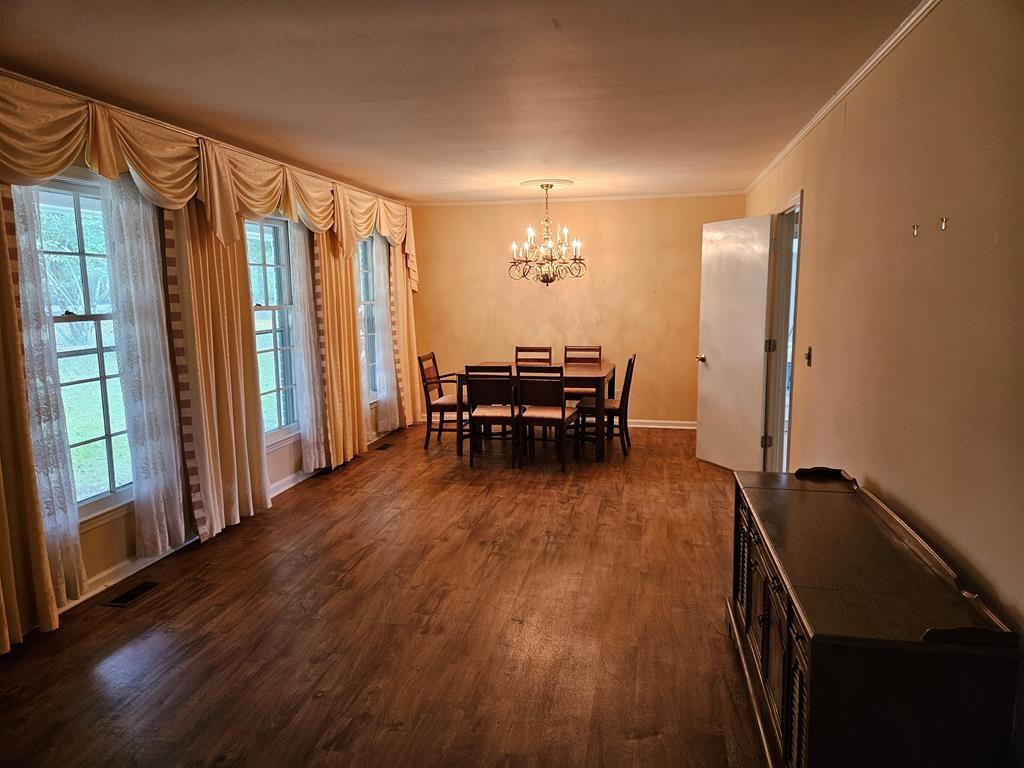 306 Grady Whitton Road Bremen, GA 30110 - Photo 33 of 48 a dining room with furniture and wooden floor