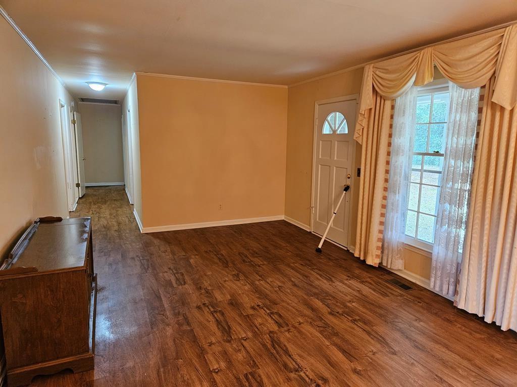 306 Grady Whitton Road Bremen, GA 30110 - Photo 35 of 48 a view of empty room with wooden floor and fan