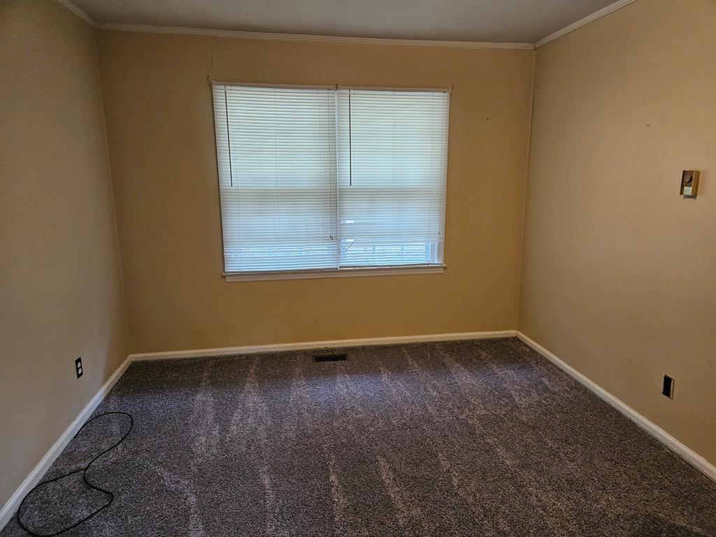 306 Grady Whitton Road Bremen, GA 30110 - Photo 37 of 48 an empty room with a window