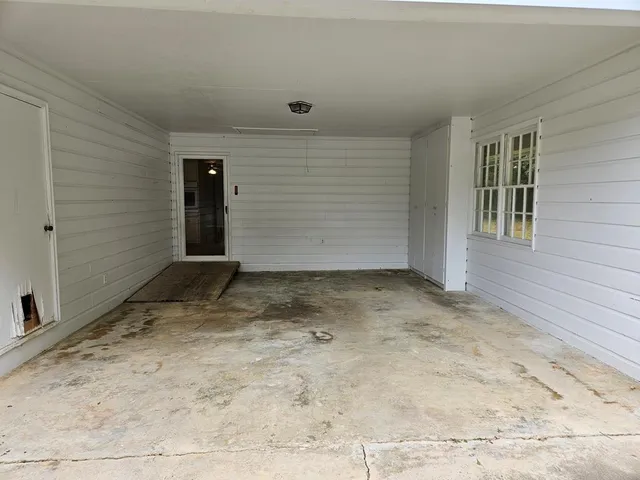 a view of a house with backyard and garden