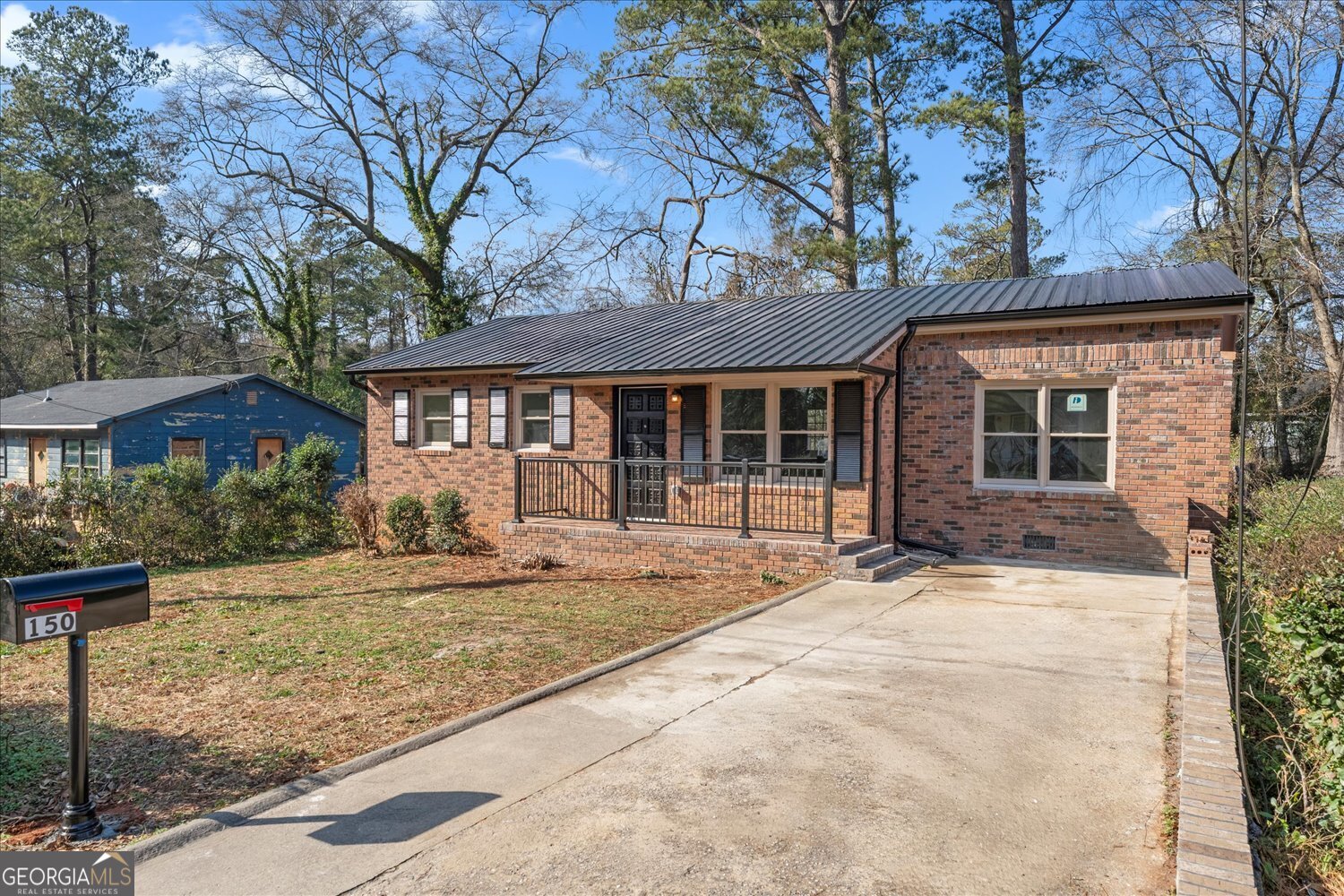 150 Royal Court Athens, GA 30601 - Photo 2 of 23 a front view of a house with a garden and patio