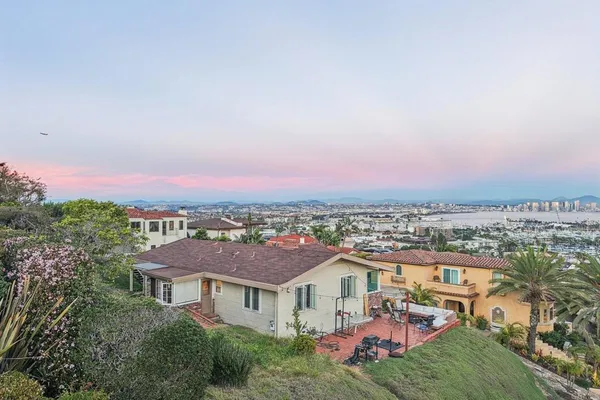 an aerial view of residential houses and city street
