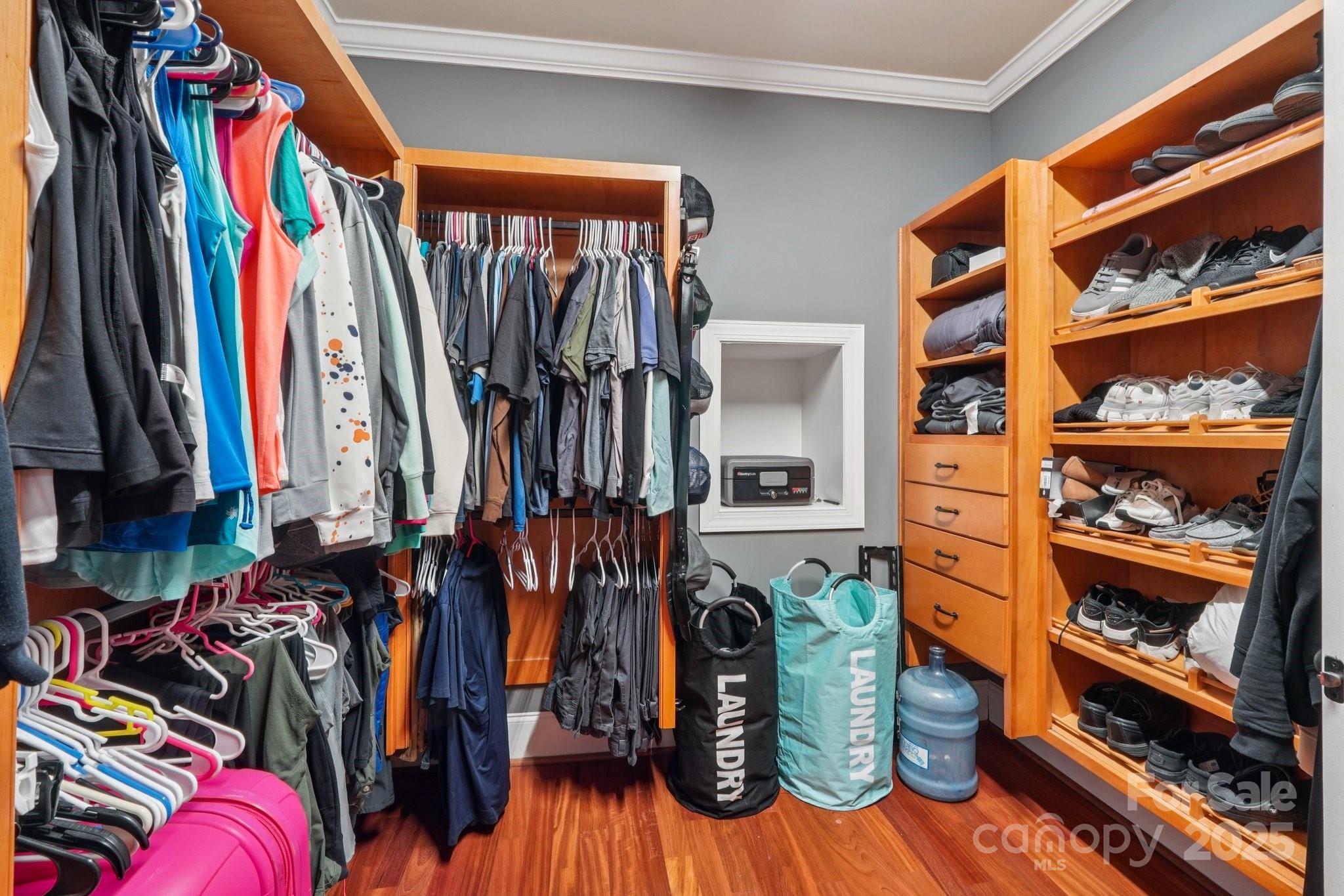 327 Johnson Dairy Road Mooresville, NC 28115 - Photo 16 of 36 a view of walk in closet with clothes and shoes