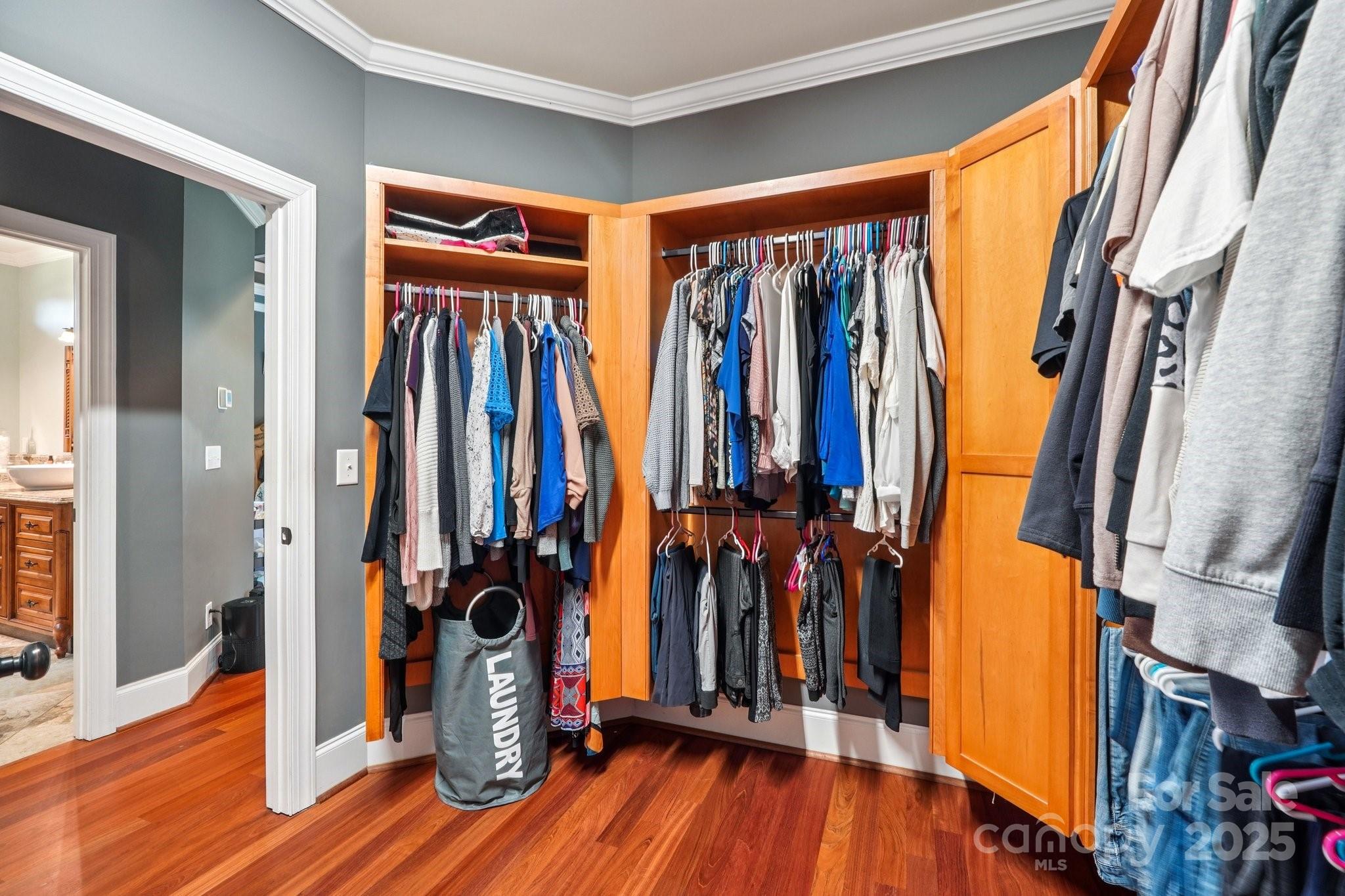 327 Johnson Dairy Road Mooresville, NC 28115 - Photo 17 of 36 a view of walk in closet with clothes and shoes