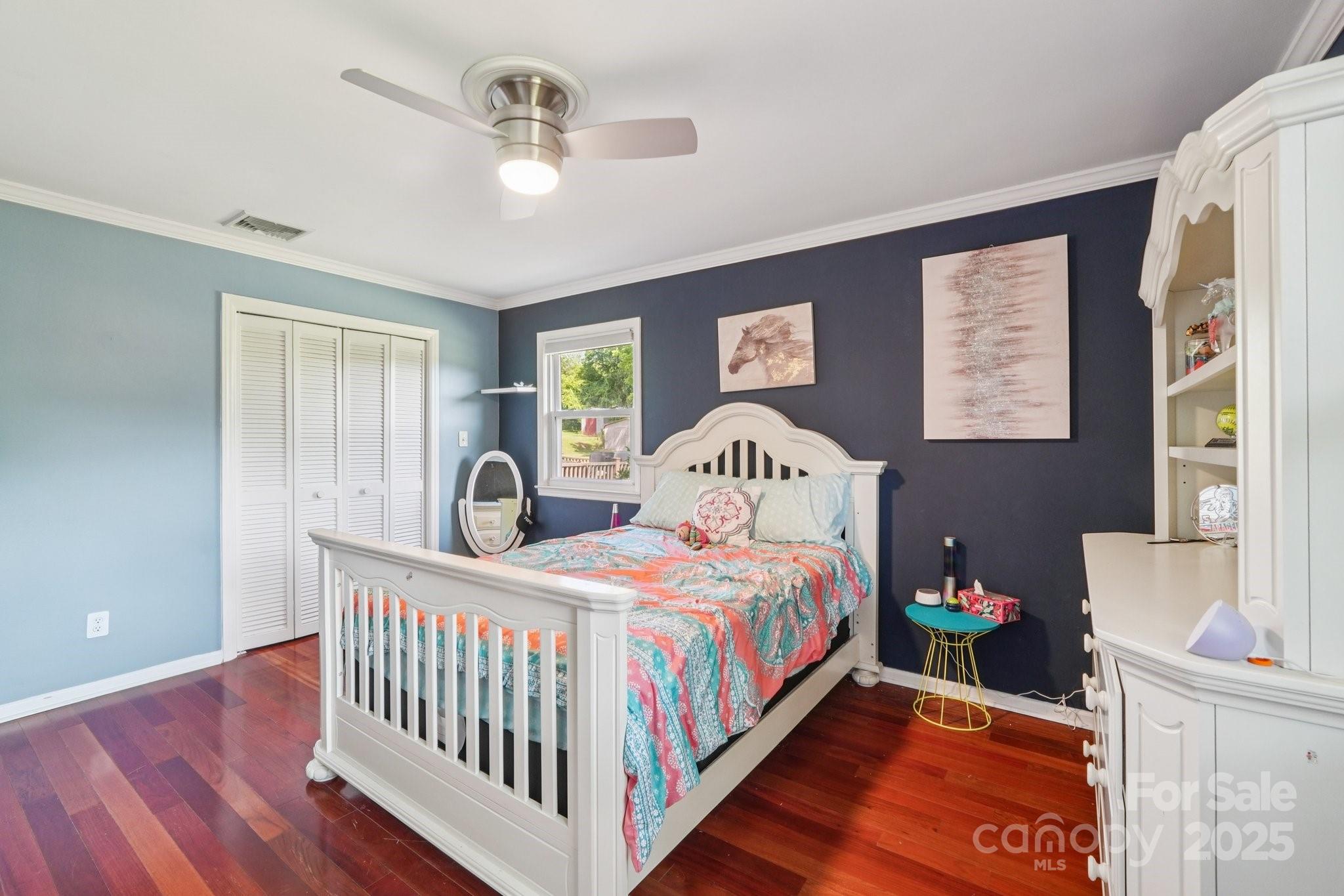 327 Johnson Dairy Road Mooresville, NC 28115 - Photo 19 of 36 a bedroom with a bed and a table in it