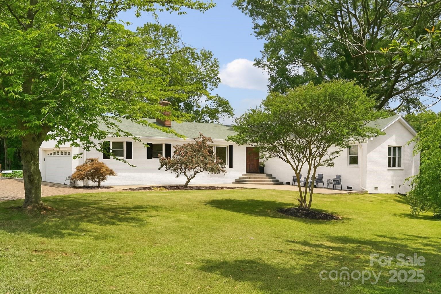 327 Johnson Dairy Road Mooresville, NC 28115 - Photo 2 of 36 a front view of a house with a yard