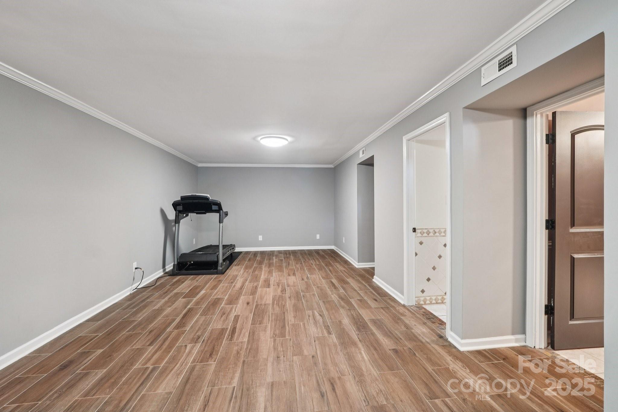 327 Johnson Dairy Road Mooresville, NC 28115 - Photo 27 of 36 a view of empty room with wooden floor