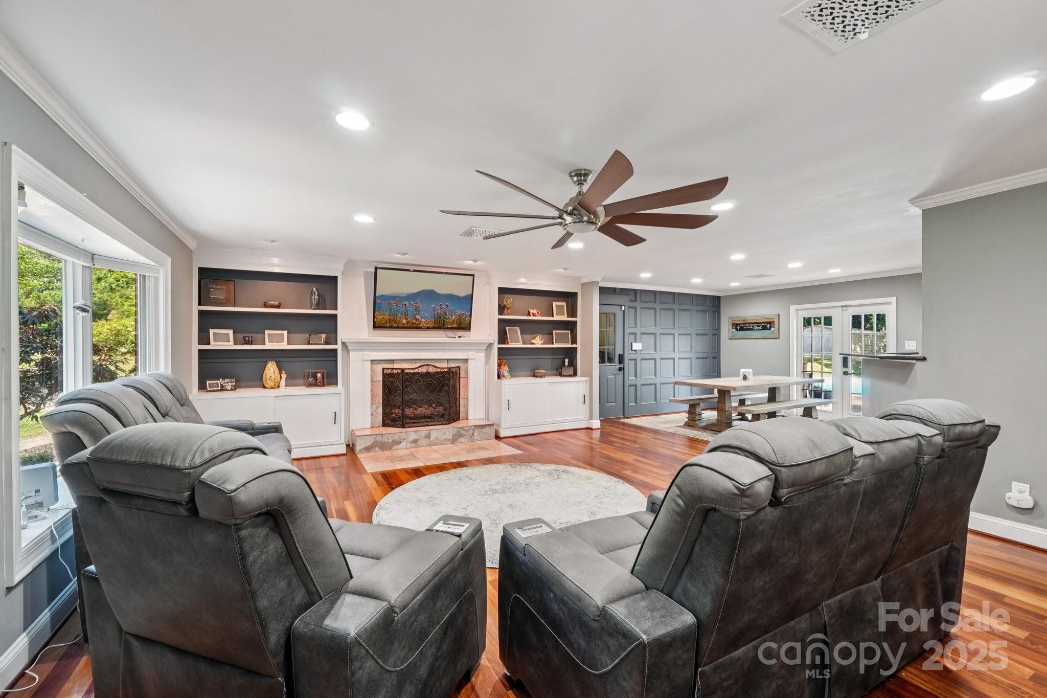 327 Johnson Dairy Road Mooresville, NC 28115 - Photo 5 of 36 a living room with furniture a window and a flat screen tv