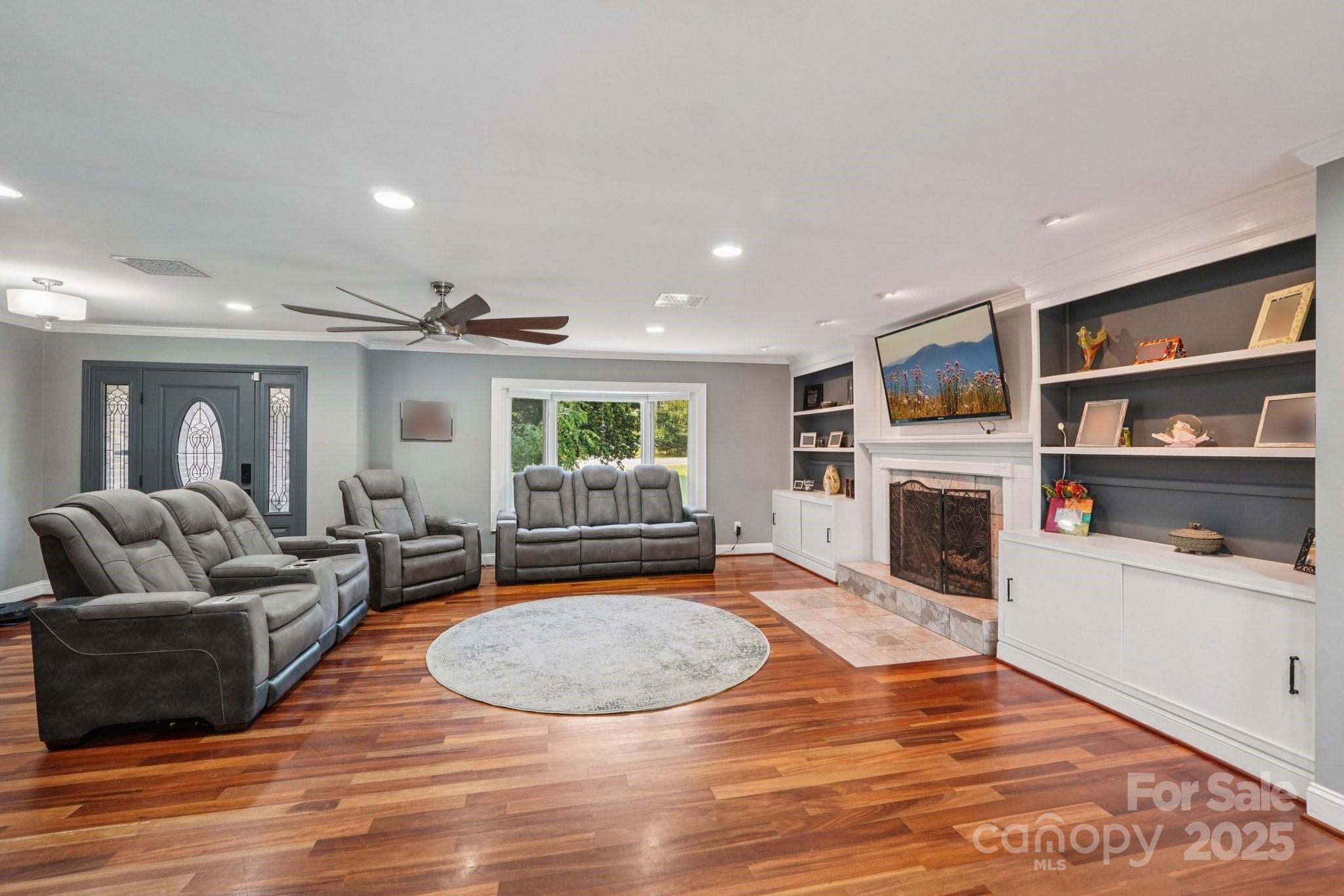 327 Johnson Dairy Road Mooresville, NC 28115 - Photo 6 of 36 a living room with furniture and a fireplace