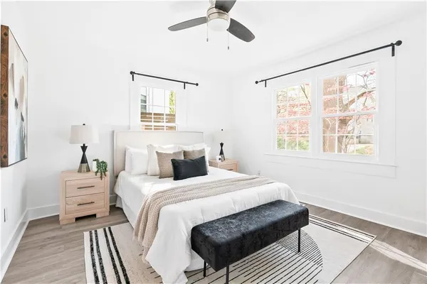 a bedroom with a bed and a window