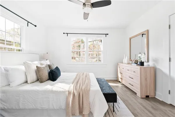 a bedroom with a bed and a window