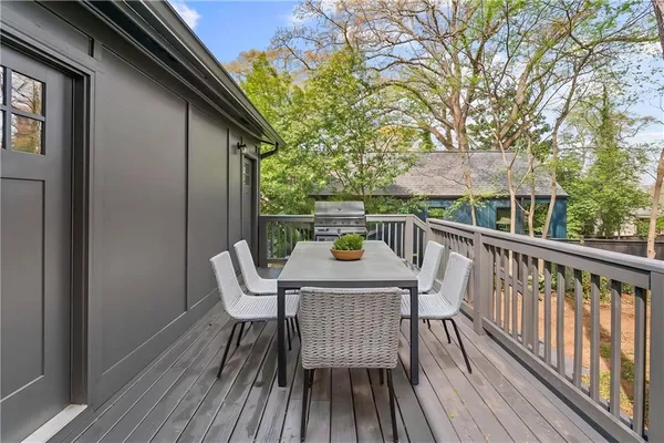 a view of balcony with furniture and wooden deck