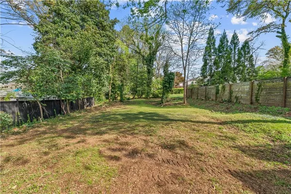a backyard of a house with lots of green space