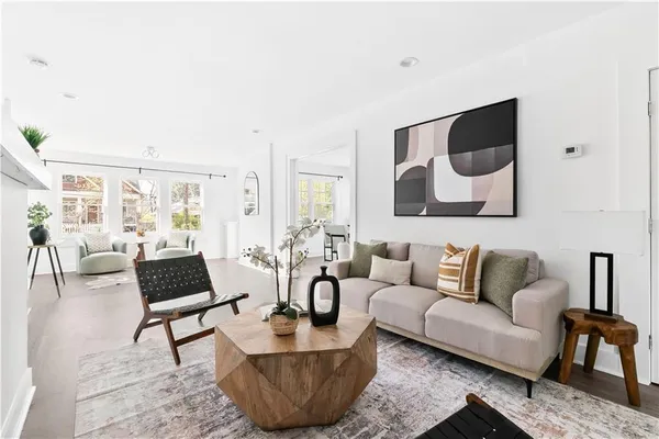 a living room with furniture and a large window