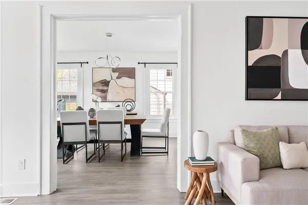 a view of a dining room with furniture and wooden floor