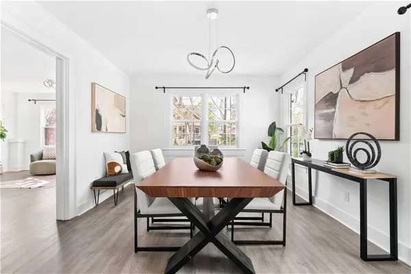 a view of a dining room with furniture window and wooden floor