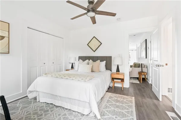 a bedroom with a bed and ceiling fan