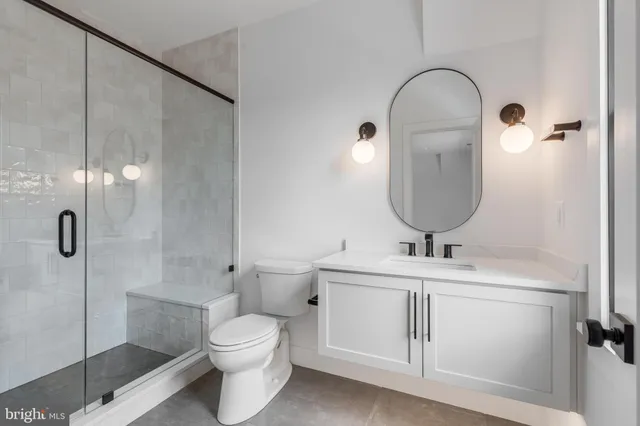 a kitchen with a dining table chairs and cabinets