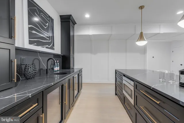 a living room with furniture and a stairs