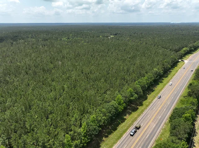 a view of a yard with an outdoor seating