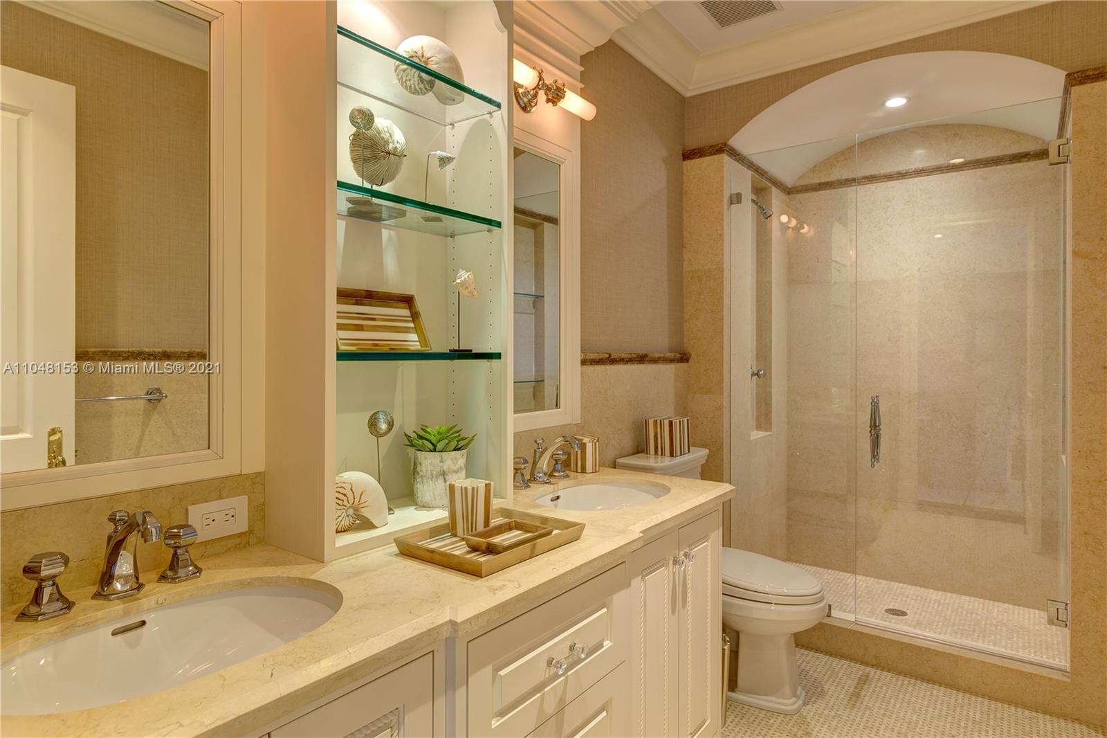 6385 Pine Tree Dr Circle Miami Beach, FL 33140 - Photo 18 of 37 a bathroom with a granite countertop sink toilet and shower