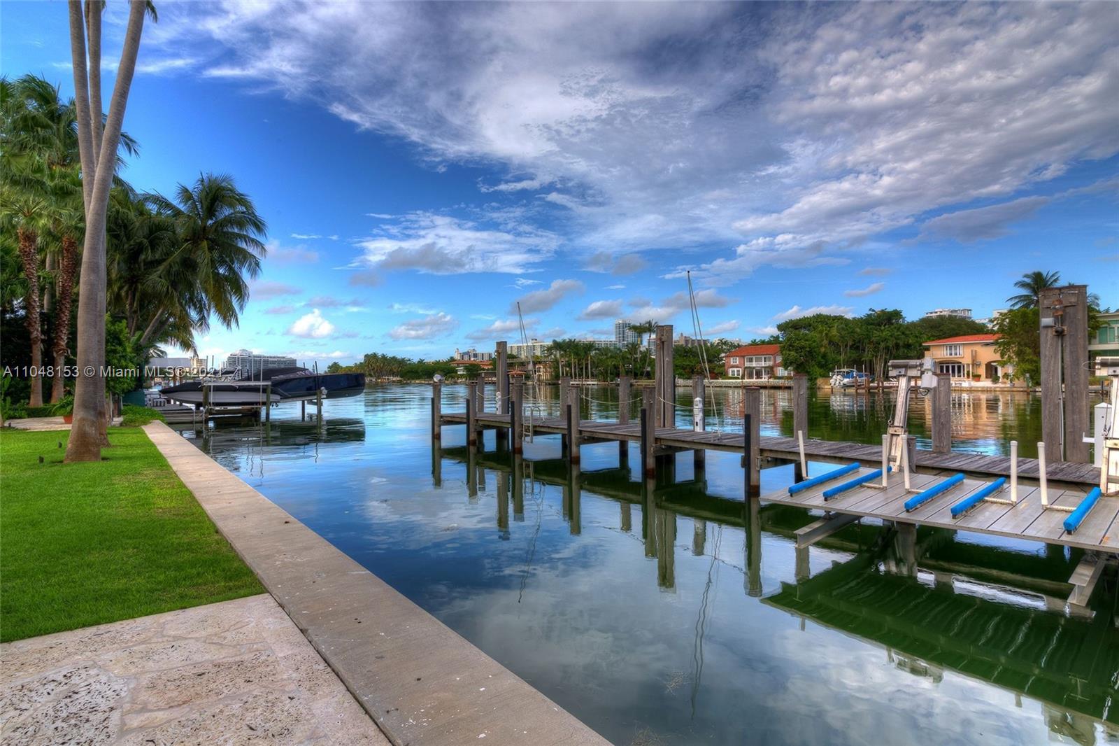 6385 Pine Tree Dr Circle Miami Beach, FL 33140 - Photo 24 of 37 a view of a backyard with a patio