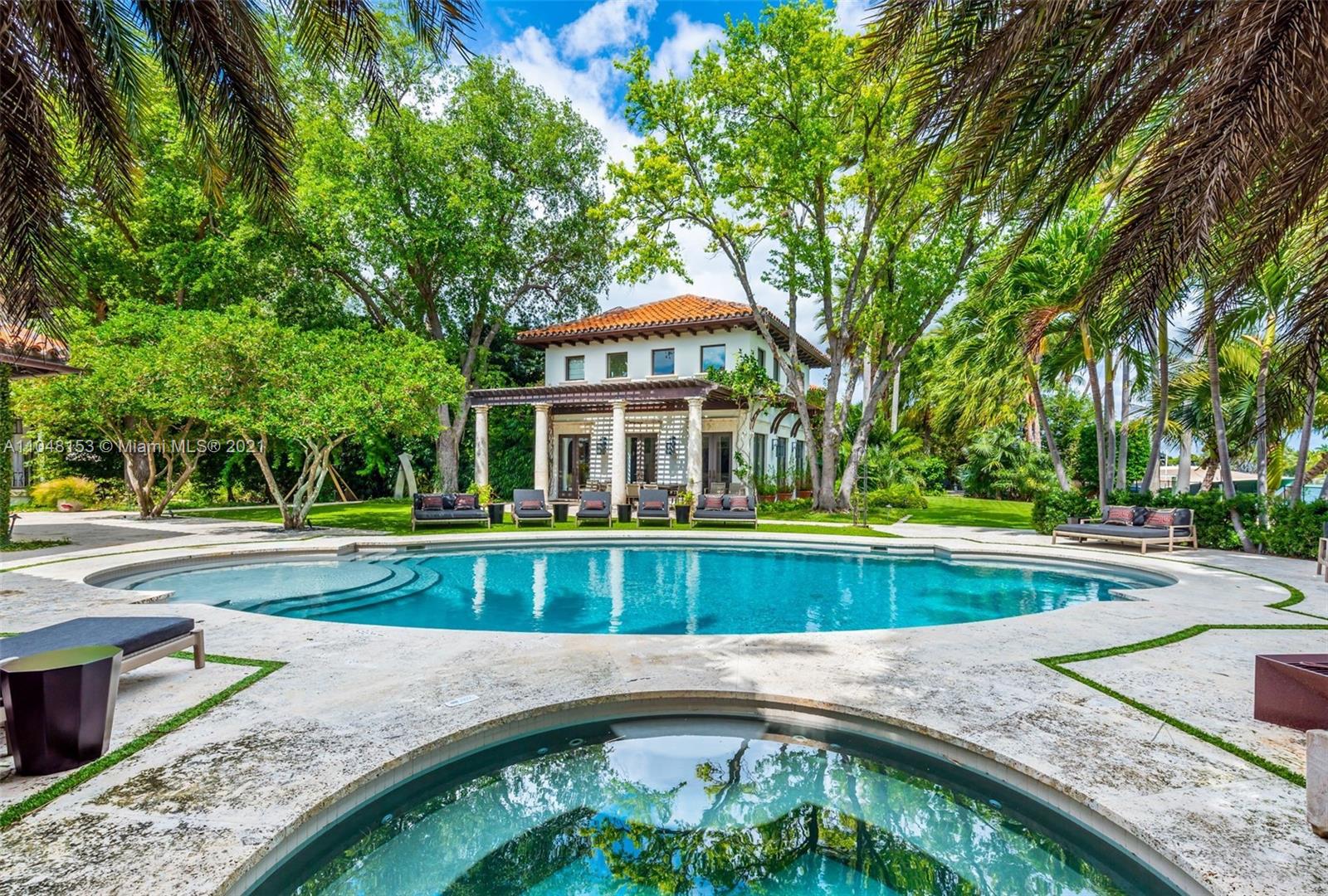 6385 Pine Tree Dr Circle Miami Beach, FL 33140 - Photo 30 of 37 a front view of a house with garden