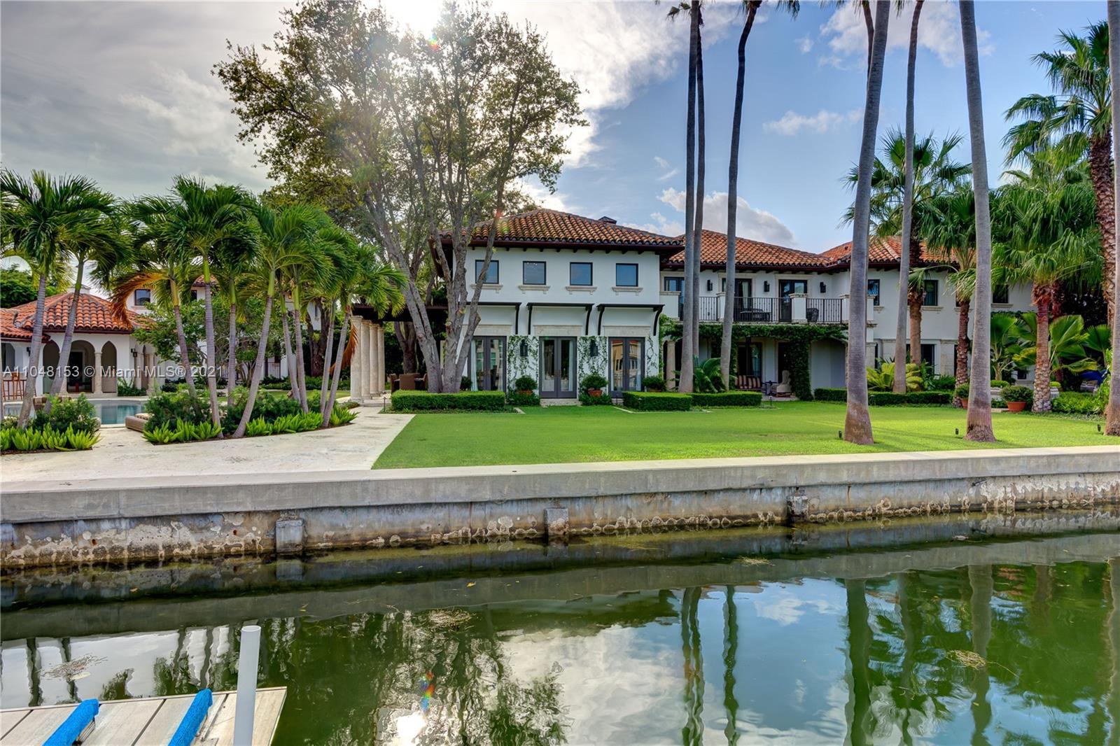 6385 Pine Tree Dr Circle Miami Beach, FL 33140 - Photo 5 of 37 a view of a water fountain in front of a building