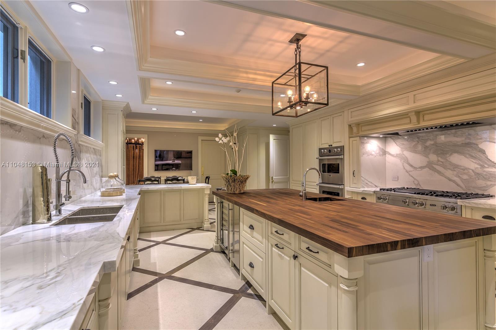 6385 Pine Tree Dr Circle Miami Beach, FL 33140 - Photo 8 of 37 a view of a kitchen counter top space and wooden floor