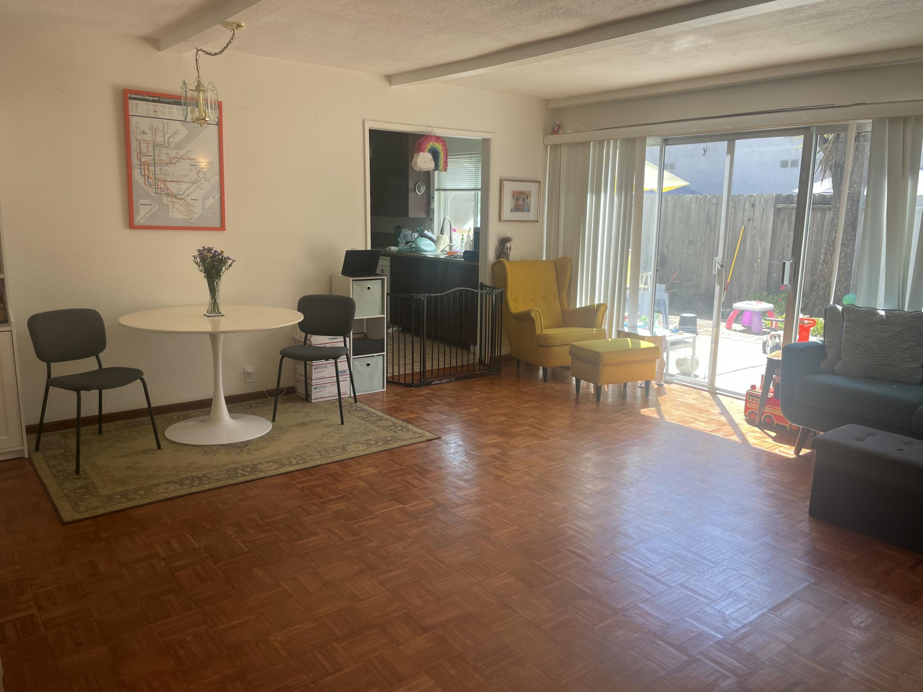 484 Linfield Place, Unit C Santa Barbara, CA 93117 - Photo 3 of 5 a living room with furniture and a large window