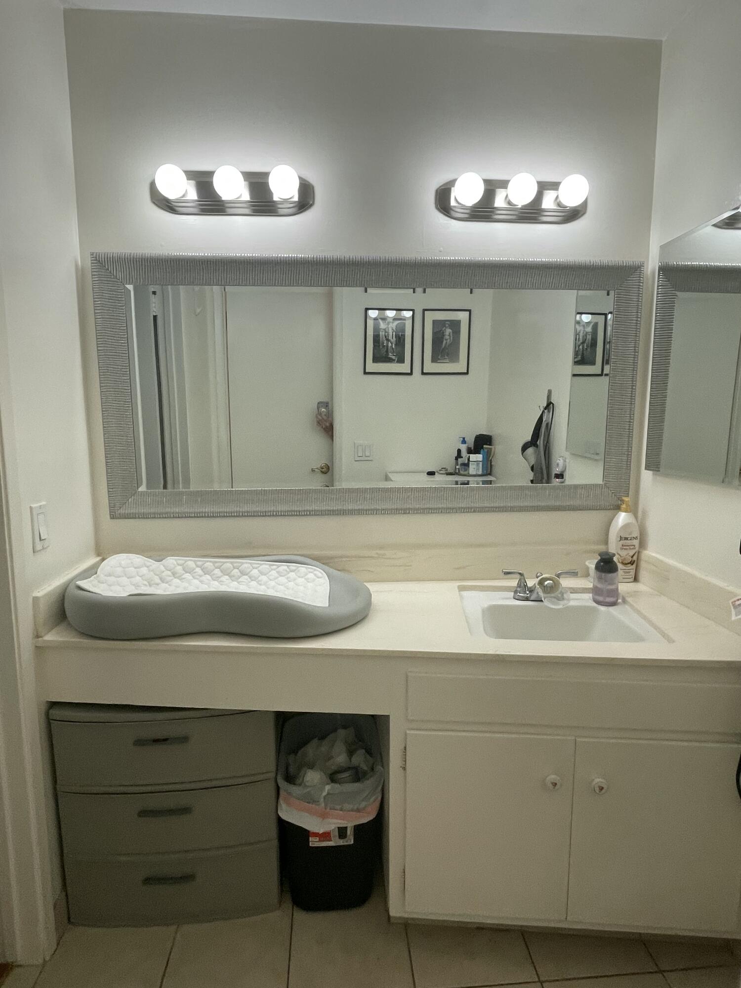484 Linfield Place, Unit C Santa Barbara, CA 93117 - Photo 4 of 5 a bathroom with a sink and a mirror