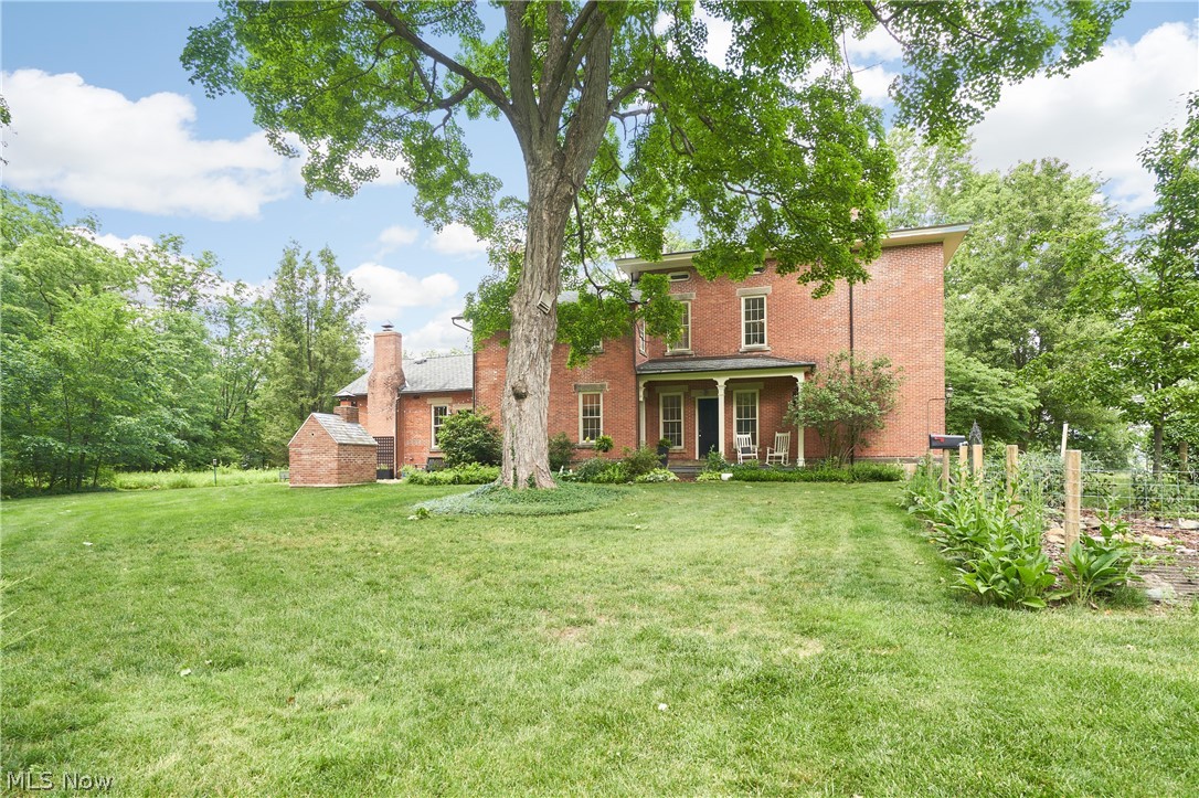 5046 Alger Road Richfield, OH 44286 - Photo 44 of 49 Classic brick exterior with a covered front porch and mature trees